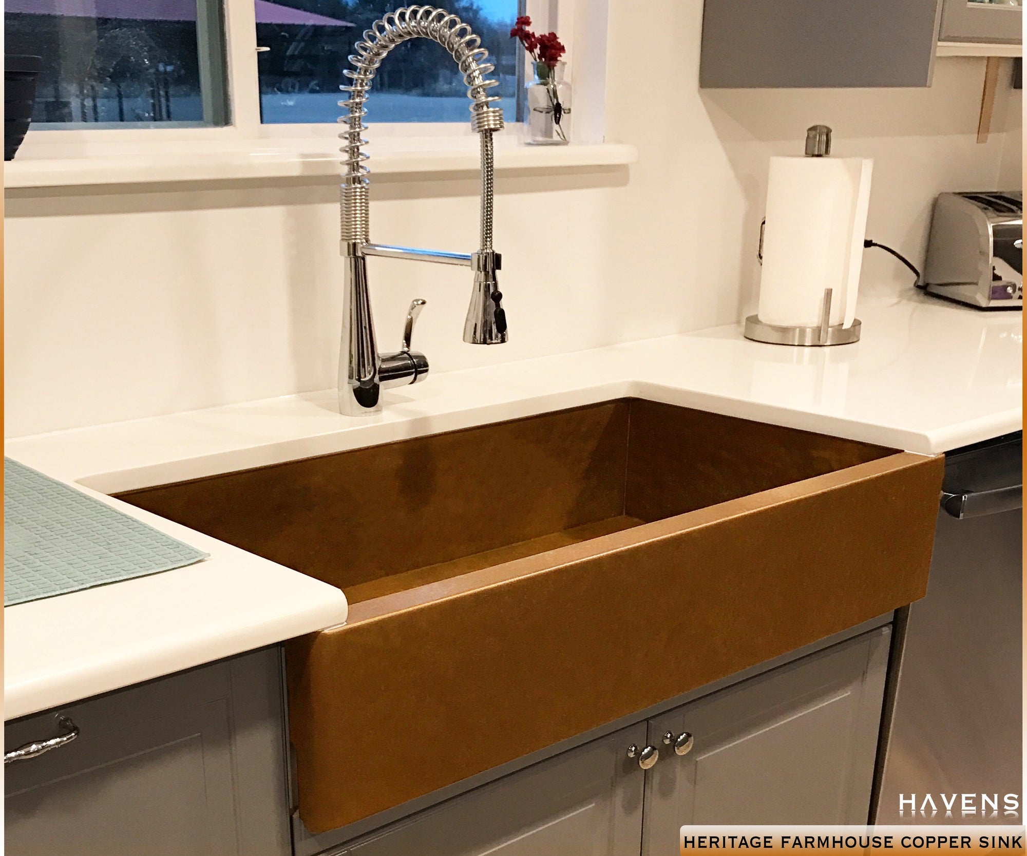 14 Gauge Copper farmhouse sink with a smooth patina apron front. USA made by Havens Luxury Metals