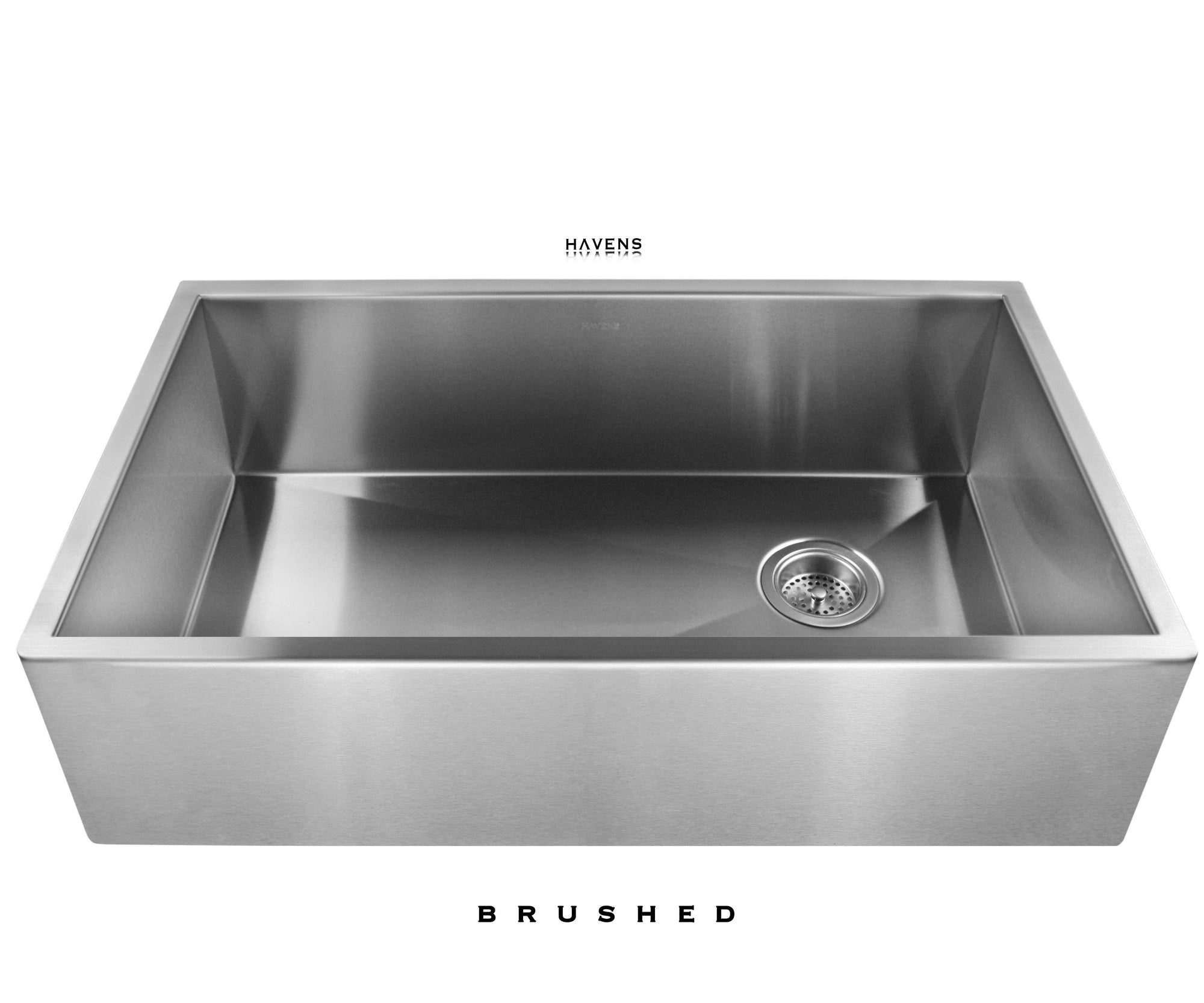 Brushed Stainless steel farmhouse apron front sink with a brushed finish. Handcrafted from 16 gauge stainless steel and installed under red quartz. 