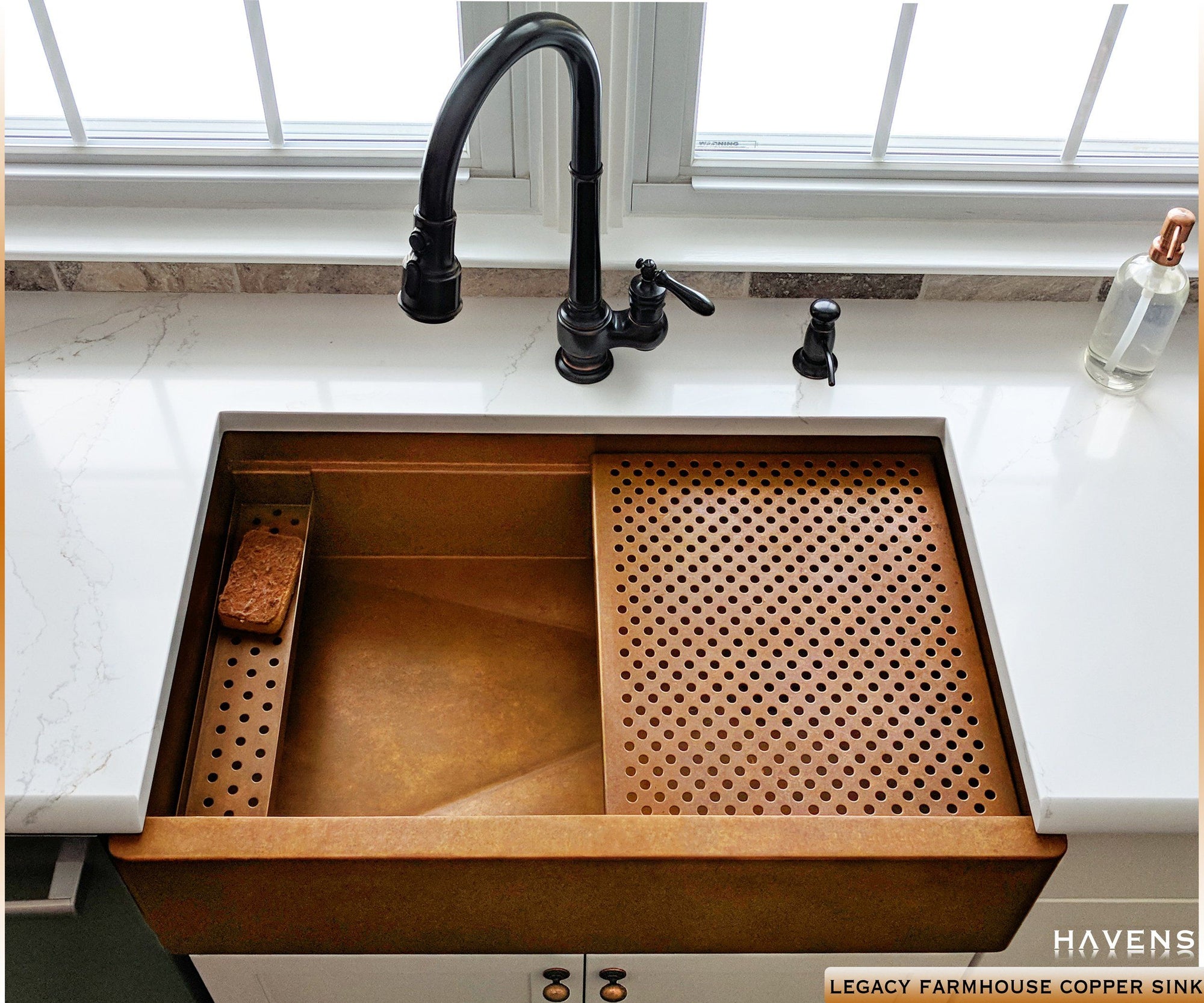 Copper farmhouse workstation sink with a built in ledge and 14 gauge smooth copper finish. Oil rubbed bronze faucet with a farm style sink. 