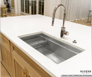 Undermount stainless steel kitchen sink made from 16 gauge steel. Textured stainless sink with a chrome faucet. 