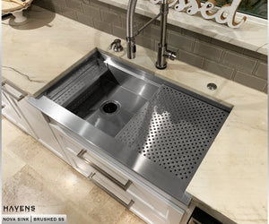 Nova stainless steel farmhouse sink with slanted sloped apron front