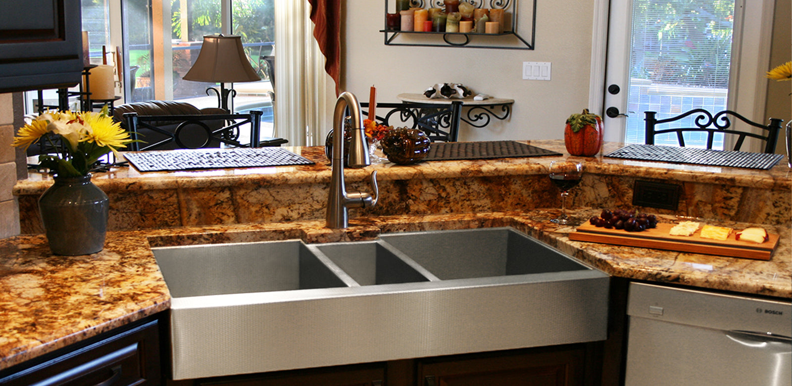 Custom stainless steel 16 gauge Havens sink. Farmhouse undermount sink with a triple bowl basin