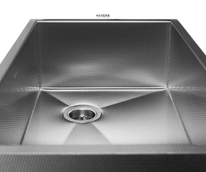 Large farmhouse sink with an apron front and right rear drain placement.