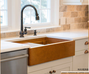 Copper farmhouse workstation sink with a built in ledge and 14 gauge smooth copper finish. Oil rubbed bronze faucet with a farm style sink. 